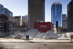 Brooks_David_image 04 David Brooks, Desert Rooftops, 2011 - 2012, Asphalt shingled rooftops, wood, vinyl siding, metal interpretive signs, 100 x 70 x 18 feet